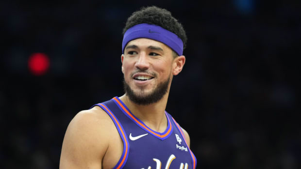 Phoenix Suns guard Devin Booker (1) looks on against the Charlotte Hornets during the first half at Footprint Center.
